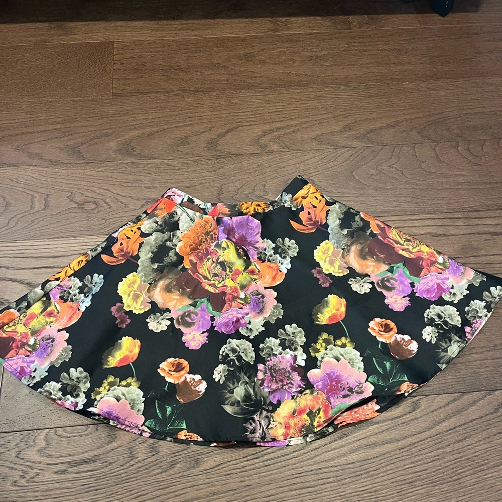 Black skirt with multicolored floral patterns